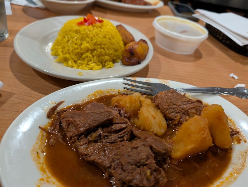 Ropa Vieja Servings That Spill Over the Plate Edges