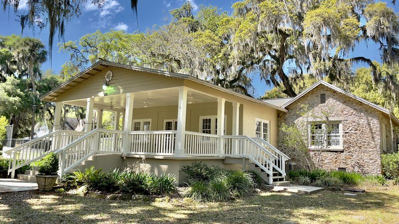 A Porch With Rocking Chairs Anchors The Whole Celebration